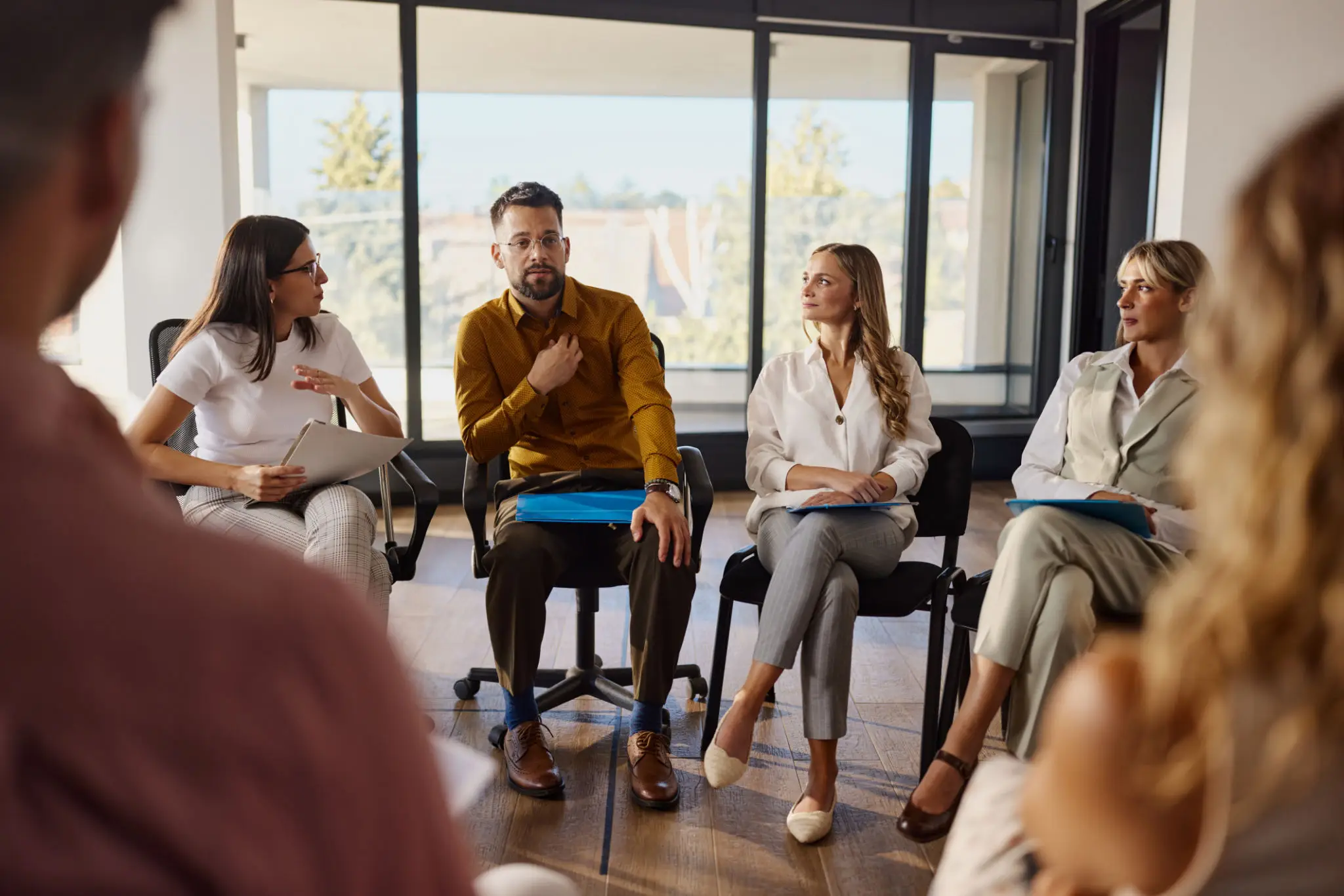 Group discussion in a bright office setting.